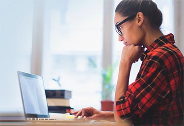 student studying on laptop